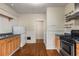 Traditional kitchen featuring wood cabinets, hardwood floors, and updated appliances at 1007 Blue Ridge Ne Ave, Atlanta, GA 30306