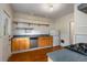 Kitchen with wooden cabinets and open shelving at 1007 Blue Ridge Ne Ave, Atlanta, GA 30306