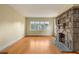 Living room showcasing a stone fireplace and a large window at 1007 Blue Ridge Ne Ave, Atlanta, GA 30306