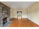 Living room with stone fireplace and entryways to other rooms at 1007 Blue Ridge Ne Ave, Atlanta, GA 30306
