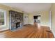 Living room with stone fireplace and entryways to other rooms at 1007 Blue Ridge Ne Ave, Atlanta, GA 30306