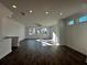 Large living space featuring wood floors, recessed lighting, and large windows at 516 Healy Dr # 69, Cumming, GA 30040