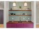 Charming bar area with open wood shelving, stylish lighting, and sleek sink at 662 Timm Valley Ne Rd, Atlanta, GA 30305