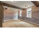 Bedroom with a scenic mountain mural, exposed wood beams, and bright windows at 662 Timm Valley Ne Rd, Atlanta, GA 30305
