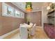 Elegant dining room with textured wallpaper, decorative lighting, and a built in bar at 662 Timm Valley Ne Rd, Atlanta, GA 30305
