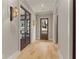Bright hallway with natural light, hardwood floors, and stylish wall sconces at 662 Timm Valley Ne Rd, Atlanta, GA 30305