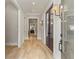 Elegant hallway with hardwood floors and decorative lighting at 662 Timm Valley Ne Rd, Atlanta, GA 30305
