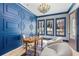 Bright home office with custom blue wall trim, a unique desk and inviting chairs at 662 Timm Valley Ne Rd, Atlanta, GA 30305