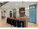 Gourmet kitchen showcases custom cabinets, stainless appliances, and seating around wood countertop at 662 Timm Valley Ne Rd, Atlanta, GA 30305