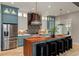 Stylish kitchen features custom cabinets, stainless appliances, and expansive wood countertop at 662 Timm Valley Ne Rd, Atlanta, GA 30305