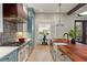 Elegant kitchen with stainless steel appliances, designer cabinets, and adjacent dining area at 662 Timm Valley Ne Rd, Atlanta, GA 30305