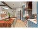 Gourmet kitchen featuring custom wood countertops, a patterned backsplash, modern appliances, and stylish cabinetry at 662 Timm Valley Ne Rd, Atlanta, GA 30305