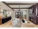 Open living space features hardwood floors, fireplace and a kitchen island at 662 Timm Valley Ne Rd, Atlanta, GA 30305