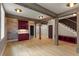 Open living room with wooden beams, hardwood floors, bar area, and stylish design at 662 Timm Valley Ne Rd, Atlanta, GA 30305