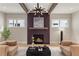 Cozy living room with a modern fireplace and exposed beams at 662 Timm Valley Ne Rd, Atlanta, GA 30305
