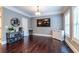 Living area featuring hardwood floors, natural light from the window, and decorative display shelving at 873 Cedar River Se Ct, Marietta, GA 30067