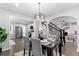 Open-concept dining room with neutral decor conveniently located between kitchen and living room at 985 Columbia Dr, Decatur, GA 30030