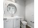 Clean bathroom with modern vanity, stylish mirror, and well-maintained toilet and fixtures at 1297 Quail Hunt Dr, Riverdale, GA 30296