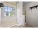 Relaxing bathroom with a soaking tub, separate shower, and large bright window at 1297 Quail Hunt Dr, Riverdale, GA 30296