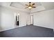 Bright bedroom featuring tray ceilings and easy access to an attached bathroom and closet at 1297 Quail Hunt Dr, Riverdale, GA 30296