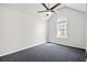 Inviting bedroom with vaulted ceiling, ceiling fan, and a large arched window at 1297 Quail Hunt Dr, Riverdale, GA 30296