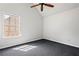 This is a primary bedroom featuring a ceiling fan and a window with natural light at 1297 Quail Hunt Dr, Riverdale, GA 30296