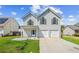 This charming two-story home with a well-maintained front yard, and two-car garage is ready for move-in at 1297 Quail Hunt Dr, Riverdale, GA 30296