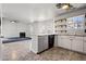The eat-in kitchen has light-colored cabinets and open shelving at 1297 Quail Hunt Dr, Riverdale, GA 30296