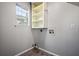 Laundry area featuring built-in shelving and utility connections, ready for appliances at 1297 Quail Hunt Dr, Riverdale, GA 30296