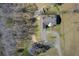 Aerial shot of the home, circular driveway, and surrounding property at 1603 Drowning Creek Rd, Dacula, GA 30019