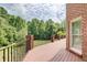 Lovely outdoor deck with metal railings and scenic backyard views, perfect for relaxing and entertaining at 1603 Drowning Creek Rd, Dacula, GA 30019