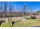 Large back yard with playset, slide, swings, and trampoline perfect for activities at 1603 Drowning Creek Rd, Dacula, GA 30019