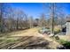 Expansive backyard with lush grass and surrounding trees, perfect for outdoor activities and relaxation at 1603 Drowning Creek Rd, Dacula, GA 30019