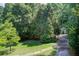 Spacious backyard with mature trees and a shed, perfect for outdoor activities at 1603 Drowning Creek Rd, Dacula, GA 30019