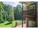 Expansive backyard featuring lush greenery, mature trees, and a charming deck, perfect for outdoor relaxation at 1603 Drowning Creek Rd, Dacula, GA 30019