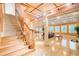 Finished basement featuring hardwood floors, stairs, and large entertainment area at 1603 Drowning Creek Rd, Dacula, GA 30019