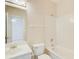 Cozy bathroom with a toilet, sink, vanity, and shower-tub combo; perfect for a small bathroom at 1603 Drowning Creek Rd, Dacula, GA 30019