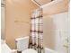 Bathroom with shower and tub includes a shower curtain for privacy at 1603 Drowning Creek Rd, Dacula, GA 30019