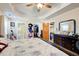 Bedroom featuring a floral duvet, with bathroom, closet, and room access at 1603 Drowning Creek Rd, Dacula, GA 30019
