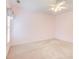 Spacious bedroom with a ceiling fan, carpeted floor, window with blinds, and soft pink walls at 1603 Drowning Creek Rd, Dacula, GA 30019