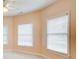 Bedroom featuring multiple windows offering natural light, carpet floors, and light peach-colored walls at 1603 Drowning Creek Rd, Dacula, GA 30019