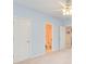 Bedroom with an open doorway to the bathroom, features light blue walls, and a ceiling fan at 1603 Drowning Creek Rd, Dacula, GA 30019