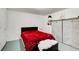 Cozy bedroom with a plush red blanket and ample closet space at 1603 Drowning Creek Rd, Dacula, GA 30019