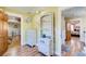 Bedroom with hardwood floors, dresser, and doorway view into another room at 1603 Drowning Creek Rd, Dacula, GA 30019
