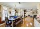 Dining room with chandelier and large table with an open view into the living room at 1603 Drowning Creek Rd, Dacula, GA 30019