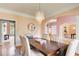 Charming dining room with a modern chandelier, hardwood floors, and easy access to living areas at 1603 Drowning Creek Rd, Dacula, GA 30019