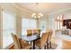 Charming dining area with a modern chandelier, hardwood floors, and natural light at 1603 Drowning Creek Rd, Dacula, GA 30019