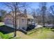 View of the exterior, with a nice yard and a balcony overlooking the landscape at 1603 Drowning Creek Rd, Dacula, GA 30019