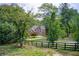 Beautiful two-story brick home with manicured lawn and mature trees at 1603 Drowning Creek Rd, Dacula, GA 30019