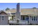 Back view of home with back deck featuring railings and access to upper level rooms at 1603 Drowning Creek Rd, Dacula, GA 30019